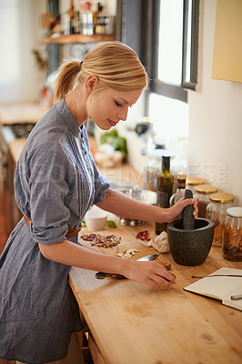 Buy stock photo Cooking, woman and mortar with grind in a home with diet, nutrition and healthy food with pestle. Kitchen, bowl and happy from organic and vegan lunch with mushroom and wood board with wellness