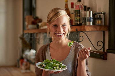 Buy stock photo Portrait, happy woman and eating salad in kitchen at home, nutrition and leafy greens for healthy diet. Vegetables, bowl and face of hungry person with food, fork and organic vegan meal for wellness