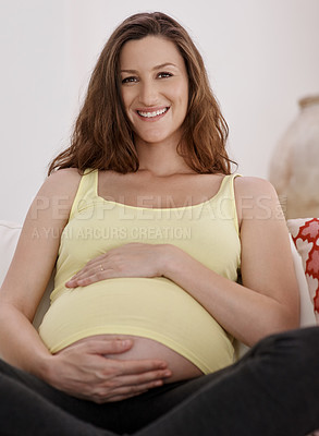 Buy stock photo Portrait of a young pregnant woman in her living room