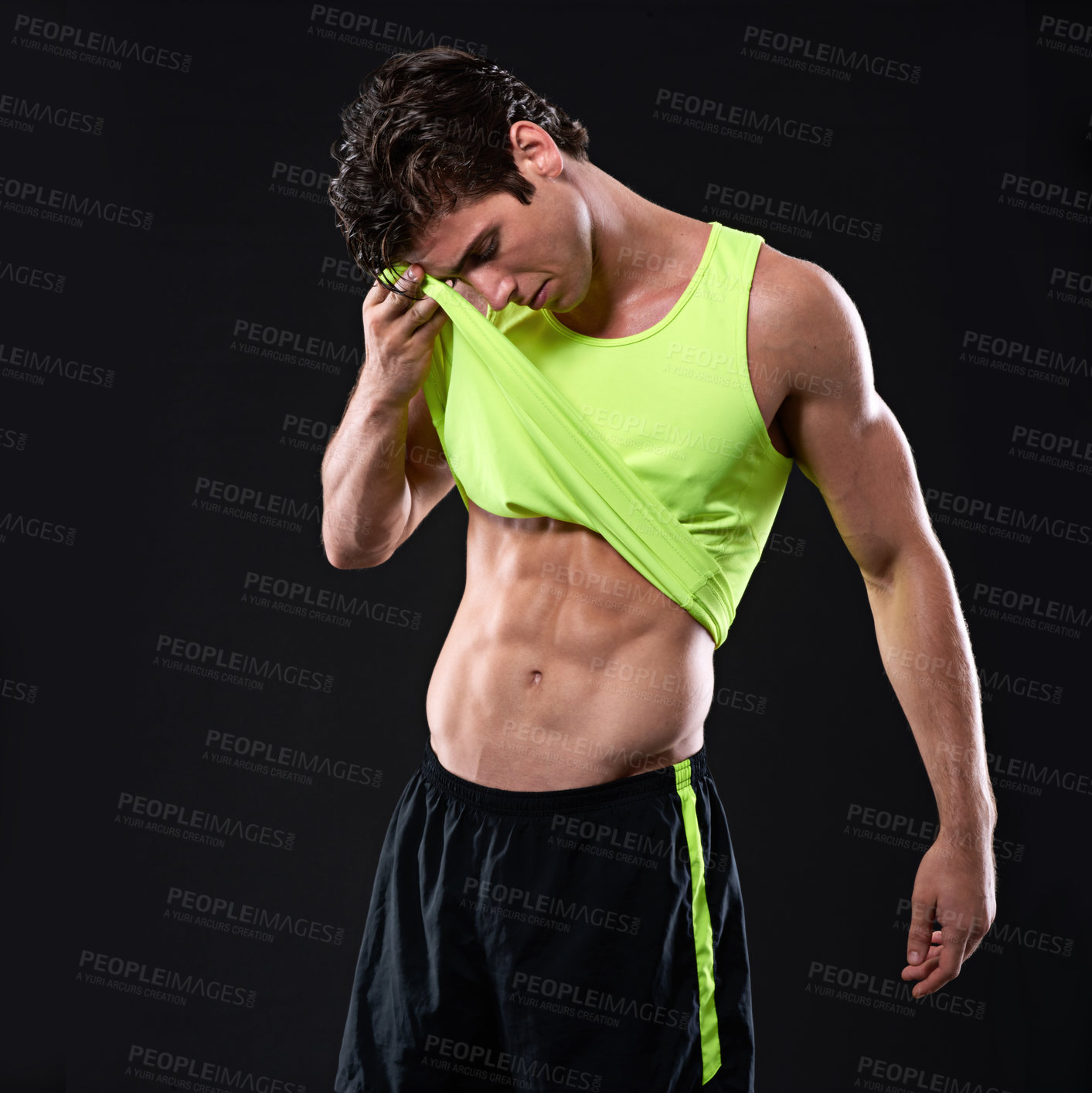 Buy stock photo Fitness, abs and strong man in studio with tshirt for sweat, workout and pride for wellness. Exercise, health and athlete or bodybuilder by black background for results, muscles and sport progress 