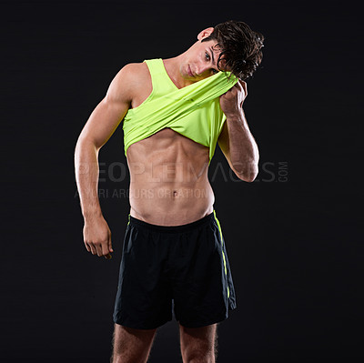 Buy stock photo Man, abs and fitness for muscles in studio with t shirt for sweat, workout and wellness challenge. Exercise, health and bodybuilder by black background for results, progress or pride for body 