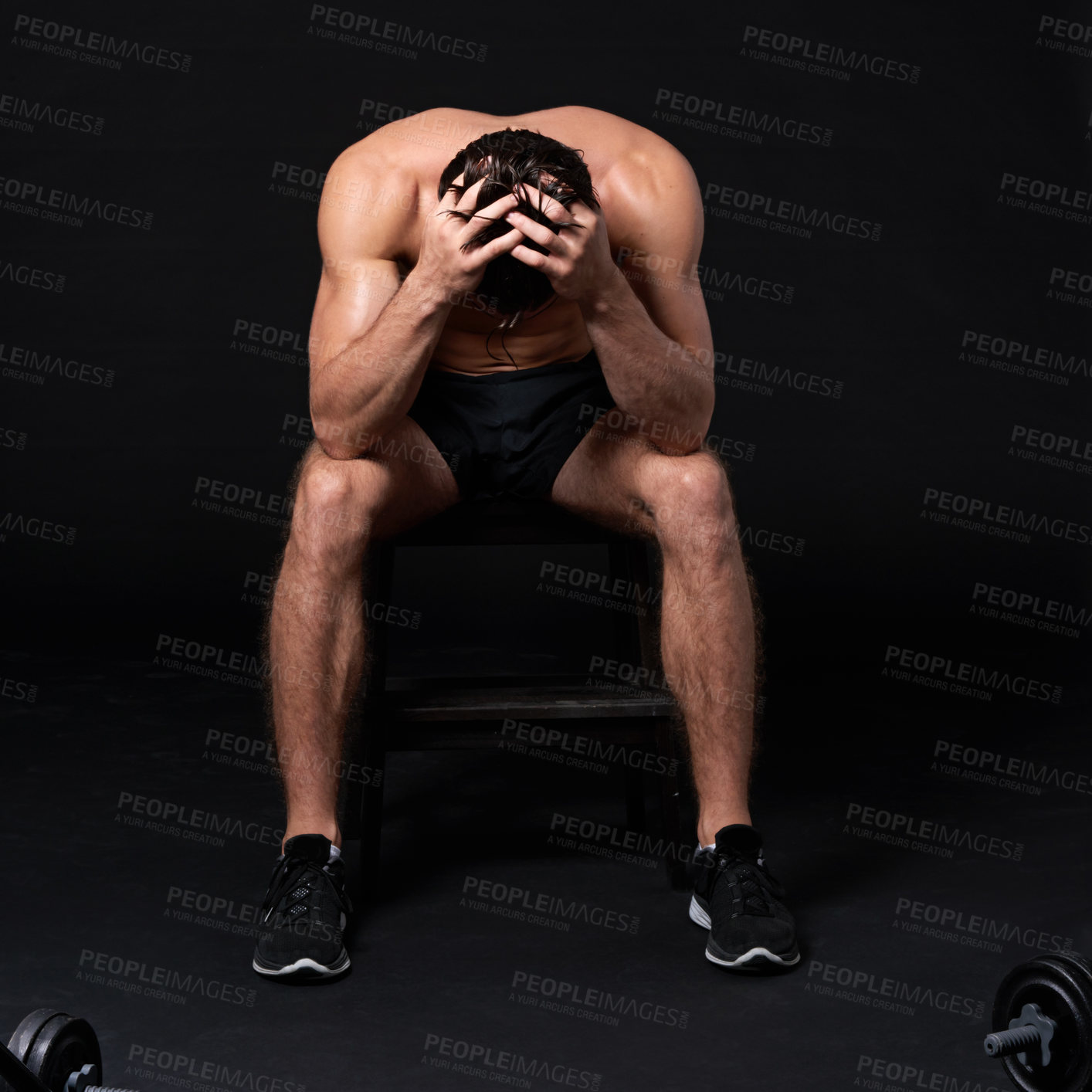 Buy stock photo Studio shot of a muscular bare-chested young man isolated on black