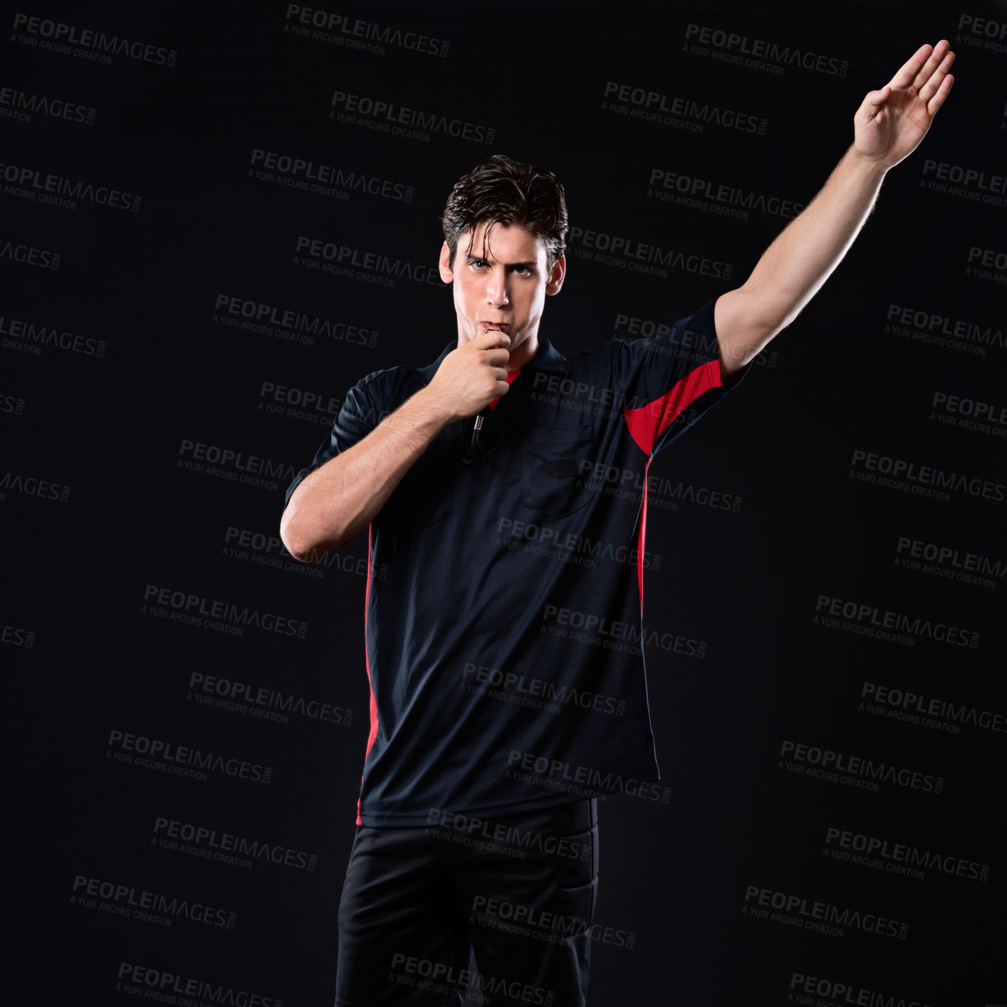 Buy stock photo Shot of a referee blowing his whistle