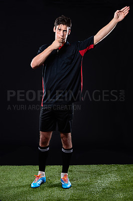 Buy stock photo Shot of a referee blowing his whistle