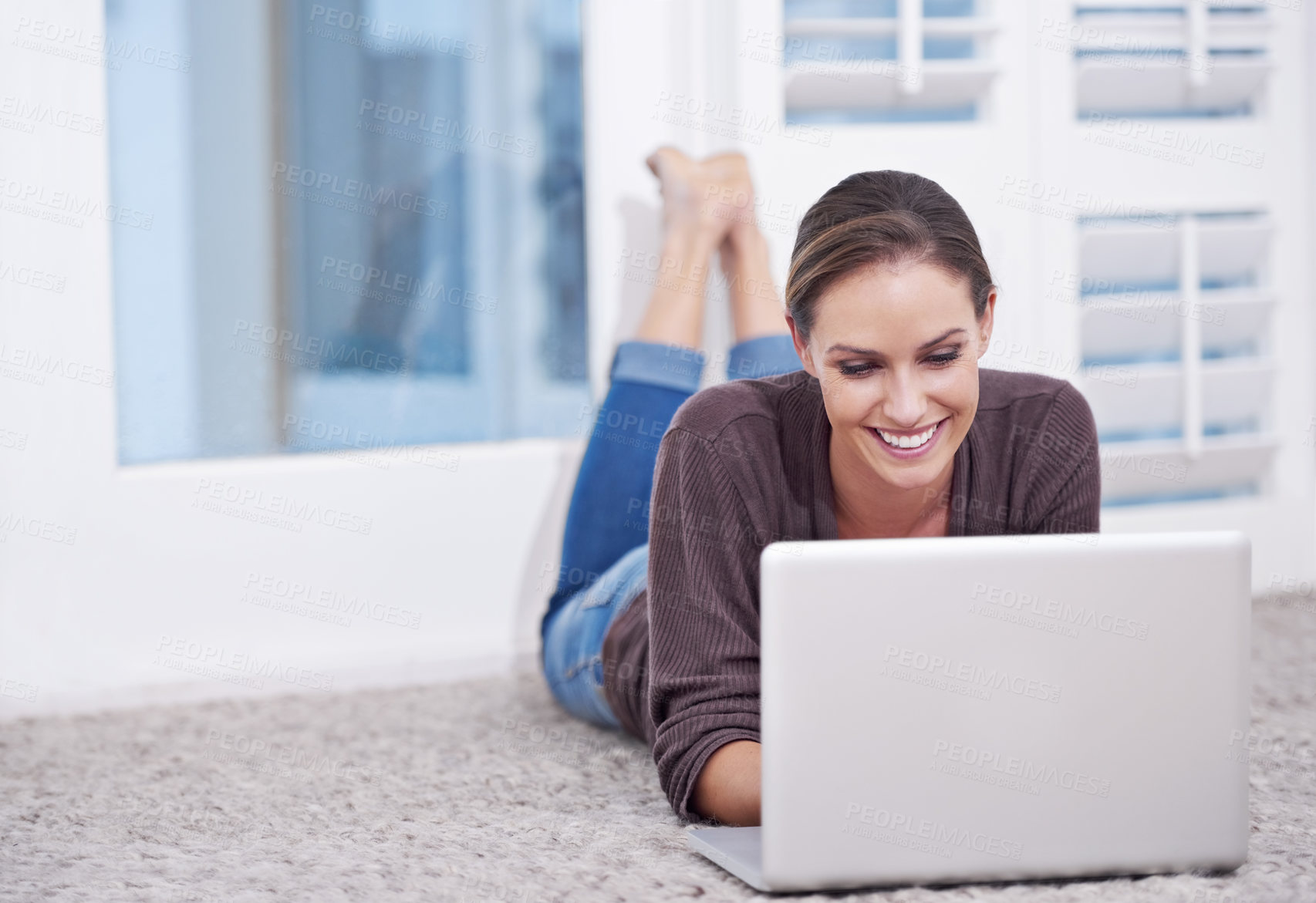 Buy stock photo Woman, remote work and laptop to relax on floor, update blog post and digital news on social media at home. Happy freelancer, computer or download subscription, online shopping or streaming on ground