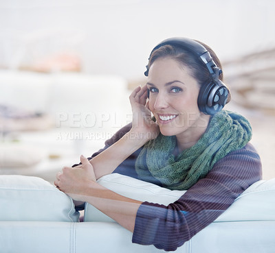 Buy stock photo Portrait, smile and woman with music headphones on a sofa streaming, listening or chilling at home. Happy, face and female person in a living room with earphones for radio, audio or playlist track