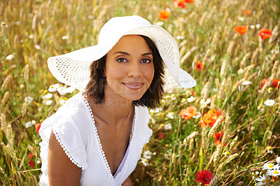 Buy stock photo Portrait, flowers or woman in an outdoor field, countryside or nature in summer to relax on break. Hat, wellness or female person in garden or farm for fresh air on holiday vacation travel or freedom