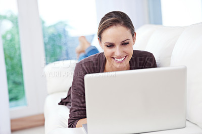 Buy stock photo Woman, laptop and relax on sofa for remote work, streaming movies and update blog post at home. Happy freelancer, computer and download subscription, online shopping and search news on social media 