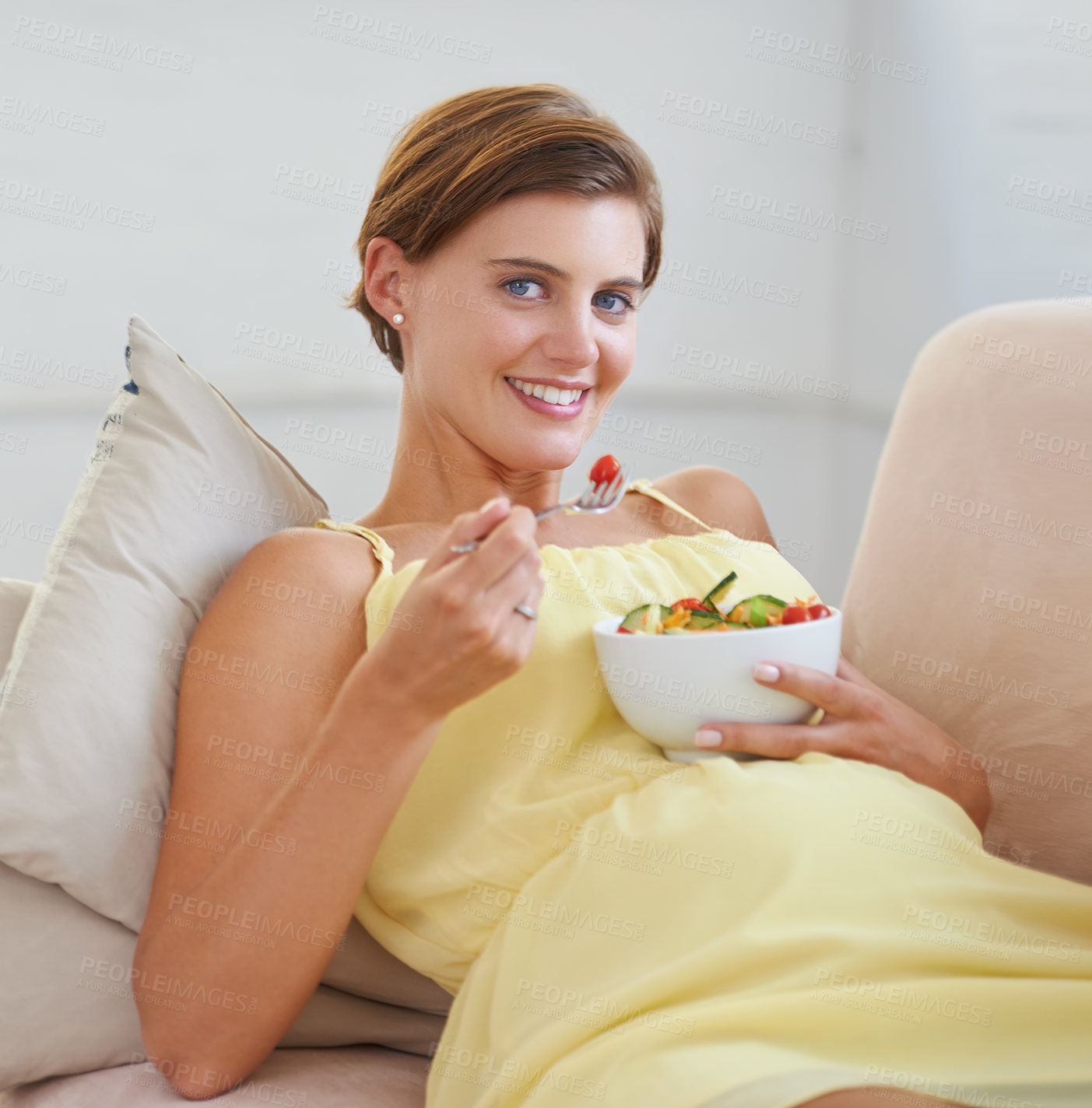 Buy stock photo Pregnant woman, salad and portrait on sofa for health, nutrition or wellness in living room of apartment. Person, vegetables or happy on couch of lounge for relax, pregnancy or healthy diet and fiber
