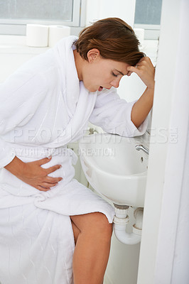 Buy stock photo Vomiting, pregnant woman and morning sickness in bathroom, nausea and hand on stomach. Mirror reflection, moody and frustrated with illness, pregnancy and struggling with migraine pain on sink