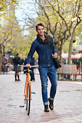 Buy stock photo Man, walk and push bike in city to travel on eco friendly transport outdoor, commute or trip. Cycling, happy person or bicycle in urban town, street or road for journey at sidewalk of park with bag
