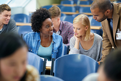 Buy stock photo University student, teacher and classroom or test help in lecture hall or education, scholarship or learning. Female people, friends and professor or paperwork at college academy, teaching or London