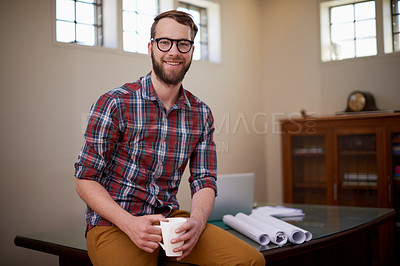 Buy stock photo Portrait, laptop and architect in office with smile for career in construction industry and coffee. Man, contractor and entrepreneur of startup, small business and blueprint with floor plan on desk