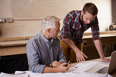 Buy stock photo Architecture, teamwork and father and son with blueprint in workshop for collaboration on laptop. Senior engineer, men and paperwork of trainee or apprentice working on design and plan with mentor.