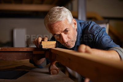 Buy stock photo Senior carpenter, wood sanding and man with precision on building construction and architecture project. Home improvement, handyman and work of a mature male employee with carpentry tool for woodwork