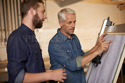 Buy stock photo Carpenter, team and men with blueprint for construction, planning project and creative. Architecture, apprentice and mentor with design, drawing and senior father with son for training at workshop