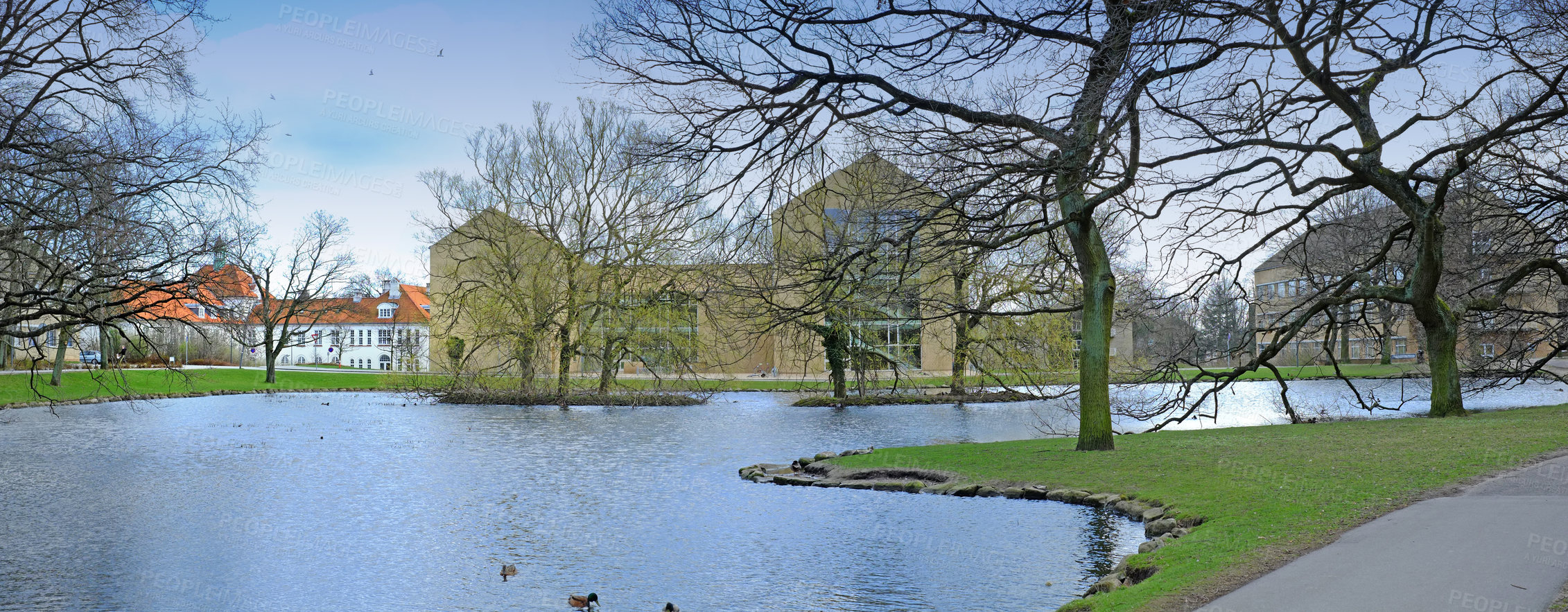 Buy stock photo House, water and river with winter nature, environment friendly and apartments in Amsterdam countryside. Bare trees, season and outdoor real estate for ecology conservation, banner and holiday home