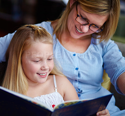 Buy stock photo Reading, story and mother with child in home with smile, learning and relax with study knowledge. Storytelling, happy mom and girl on library couch together with books, fantasy and education.