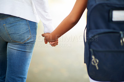 Buy stock photo Teacher, student and holding hands while walking to school in outdoor park for support or responsibility. Closeup or rear view of person or educator with learner, kid or young child with backpack