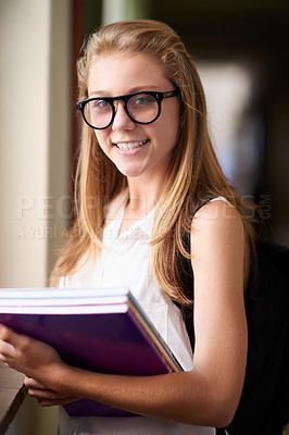 Buy stock photo Happy woman, portrait and student nerd with books at school hallway for education, study or learning. Young female person, teenager or geek smile with glasses and textbooks for knowledge in corridor