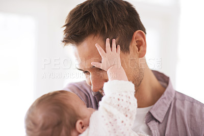 Buy stock photo Love, father and baby with touch in home for bonding, comfort or playing together for healthy development. Family, man and newborn child with smile, embrace and relax for parenting, care or security