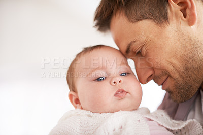 Buy stock photo Father, baby and home with hug, support and love together with newborn and smile. Happy, family and dad with young child in a living room with parent care in a house bonding with calm infant