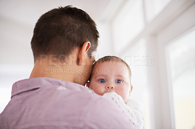 Buy stock photo Father, baby and home with portrait, support and bonding together with newborn and love. Happy, family and dad with young child in a living room with parent care in a house carrying a calm infant