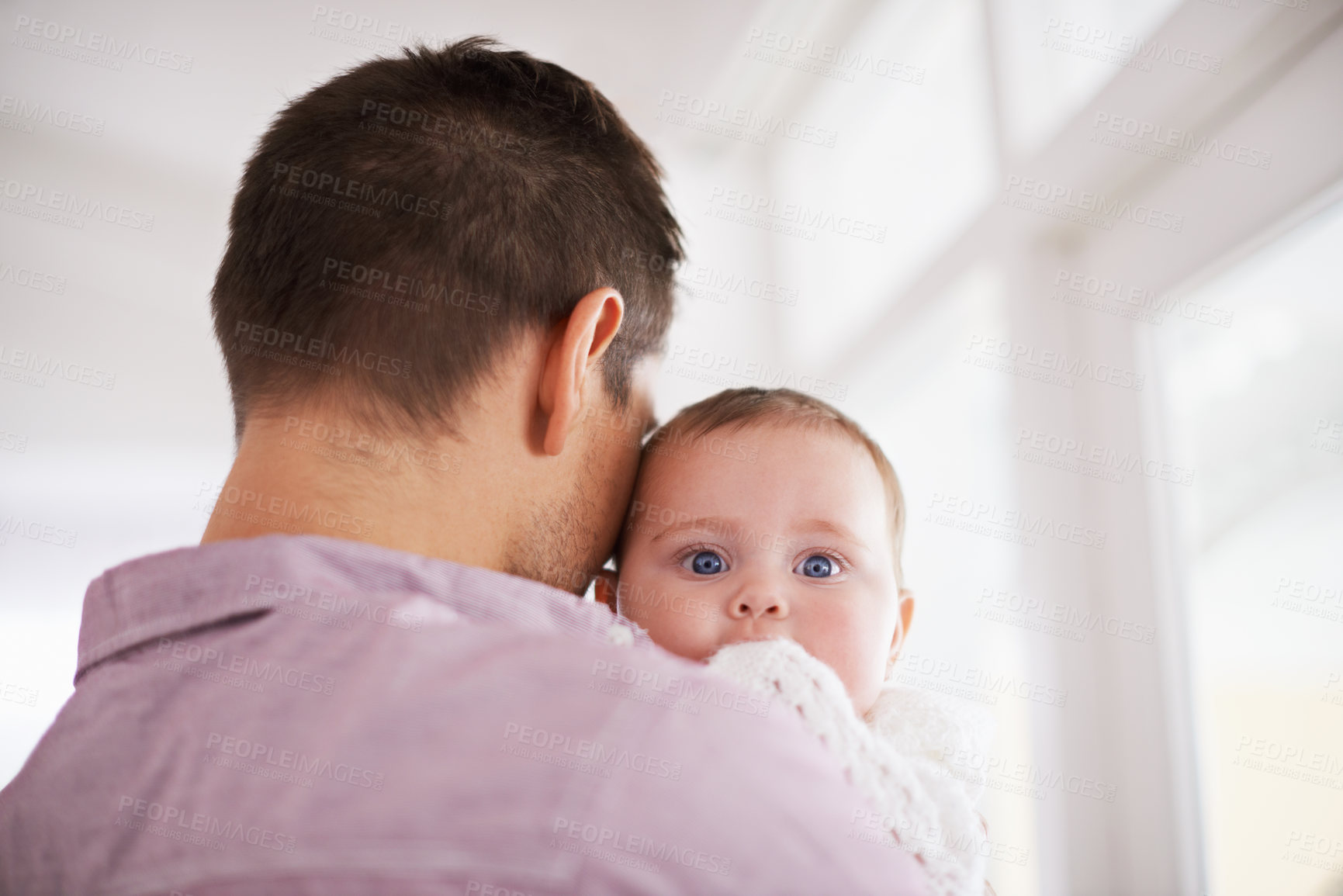 Buy stock photo Father, baby and home with portrait, support and bonding together with newborn and love. Happy, family and dad with young child in a living room with parent care in a house carrying a calm infant