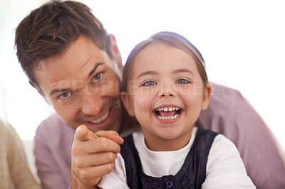 Buy stock photo Father, daughter and portrait pointing, smile and bonding together at house. Family, growth and development of young girl, dad and single parent sharing cute moment, excitement and gesturing forward