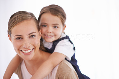 Buy stock photo Mother, kid and piggyback in portrait in studio with games, love and bonding with smile while playing on white background. Playful woman, young girl and happy with fun time together for childhood