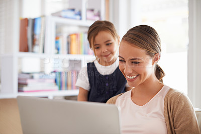 Buy stock photo Home, family and mother with girl, laptop and internet with online reading and bonding together. Single parent, kid or mama with computer or technology with child development or teaching with website