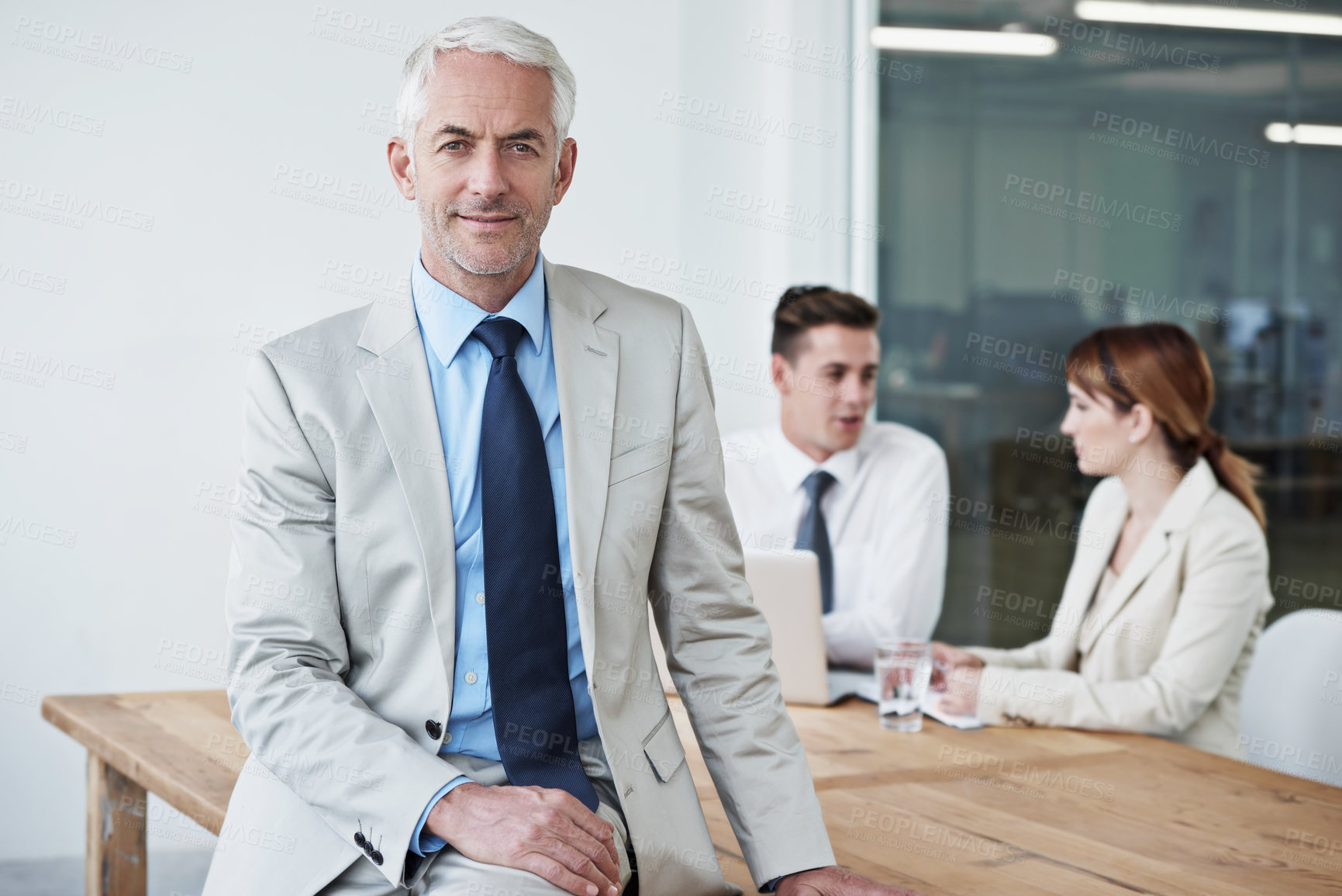Buy stock photo Smile, manager and portrait of businessman in office at meeting with team for corporate legal case. Happy, confident and senior male attorney ceo on table in workplace boardroom for law project.