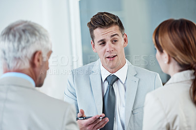 Buy stock photo Discussion, interview and hr with candidate in office for business meeting, onboarding or recruitment. Conversation, hiring and man talking to human resources managers in workplace boardroom.