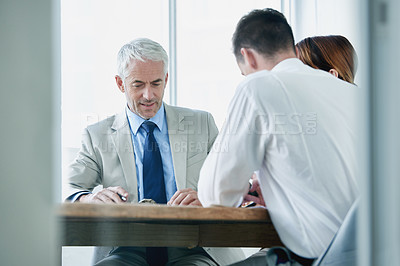 Buy stock photo Business people, writing and contract paperwork for collaboration, strategy or notes at office. Group, teamwork or employees with documents or negotiation in meeting for brainstorming at workplace