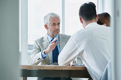 Buy stock photo Shot of business people in a business meeting
