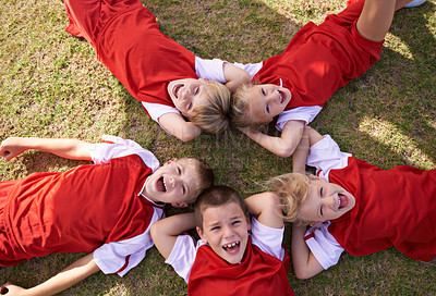 Buy stock photo Children, soccer team and portrait with smile, boys and girls with high angle, support or solidarity. Energy, sports and friendship, together and happy for win, ready for game and physical activity