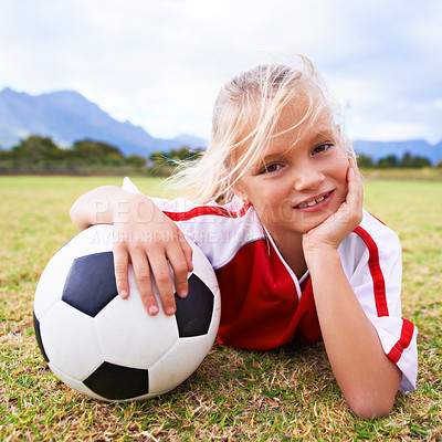 Buy stock photo Girl, soccer player and ball with portrait, smile and ready for game, field and child. Outdoor, playful and sport for childhood, happy and athlete for match, alone and outside on football pitch