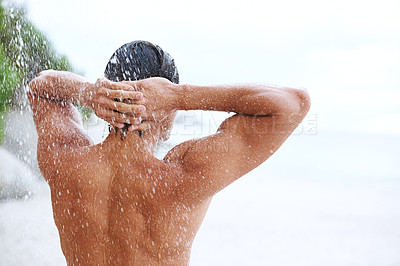Buy stock photo Shower, beach and man with water for cleaning, washing hair and grooming for healthy skin. Beauty, nature and back of person with splash for hygiene, wellness and skincare hydration and cleanse