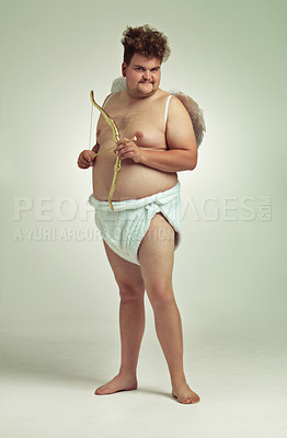 Buy stock photo An obese man dressed as a cherub with a bow and arrow
