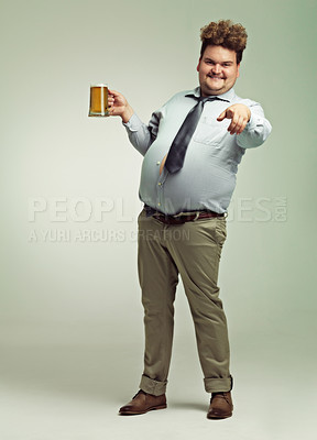 Buy stock photo Man, portrait and pointing to you with beer for celebration, drink or party on a studio background. Male person or plus size model with glass or mug for beverage, wine or drinking on mockup space