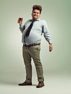 Buy stock photo Plus size, portrait and man with beer in studio to enjoy drinking alcohol from pint glass for fun. Adult, guy and male person with smile, drunk and holding mug with beverage in party for break