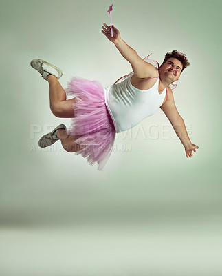 Buy stock photo A flying overweight man comically dressed-up in a pink fairy costume