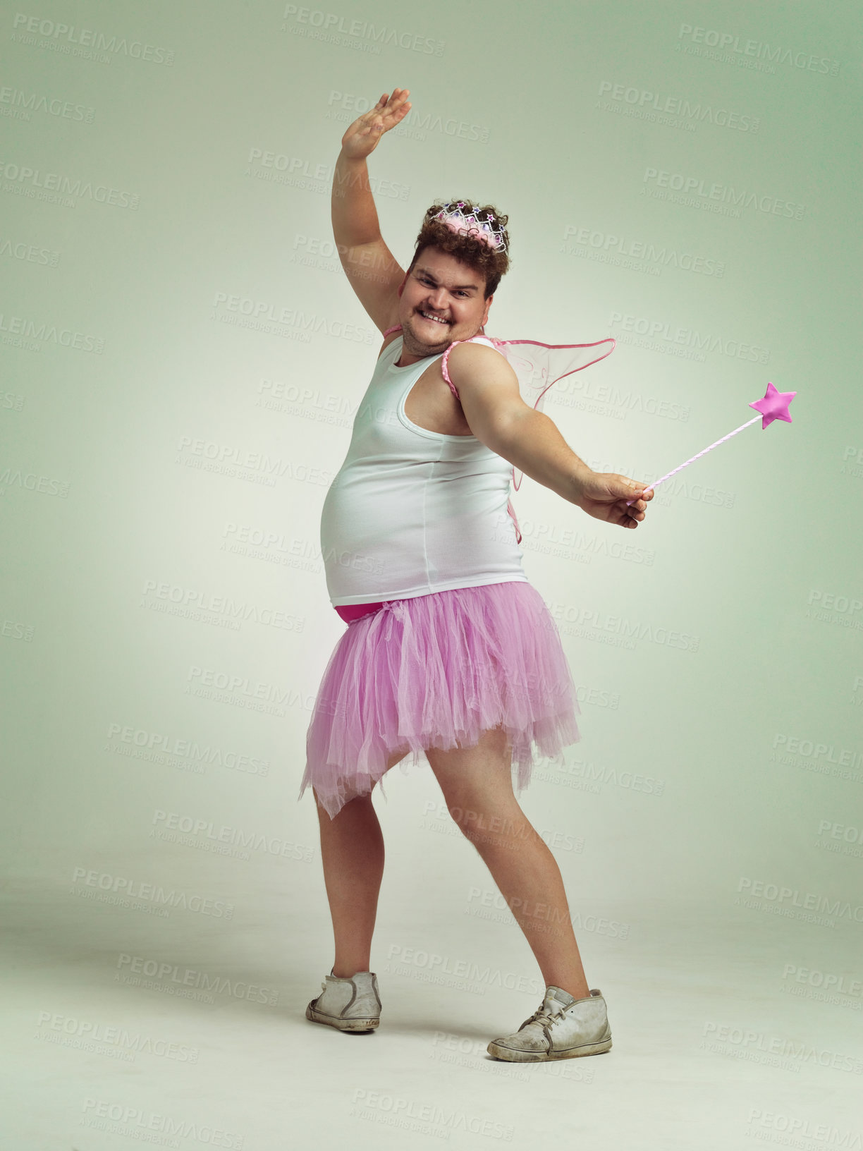 Buy stock photo An overweight man comically dressed-up in a pink fairy costume