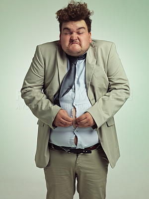 Buy stock photo Overweight, portrait and man fitting in shirt, studio and employee with stomach for clothes. Plus size, male person and guy with obesity unhappy with fat of belly in suit for professional job