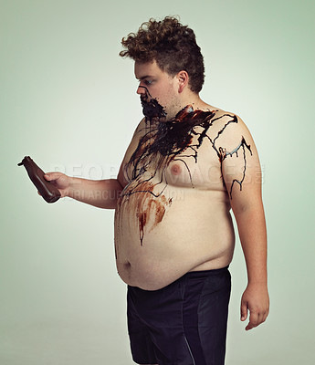 Buy stock photo Overweight man covered in chocolate sauce