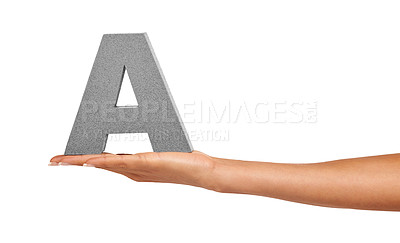 Buy stock photo Alphabet, studio and a hand with capital letter A for learning, advertising or font. Woman show or holding sign, character or text for communication, typo and grammar isolated on a white background