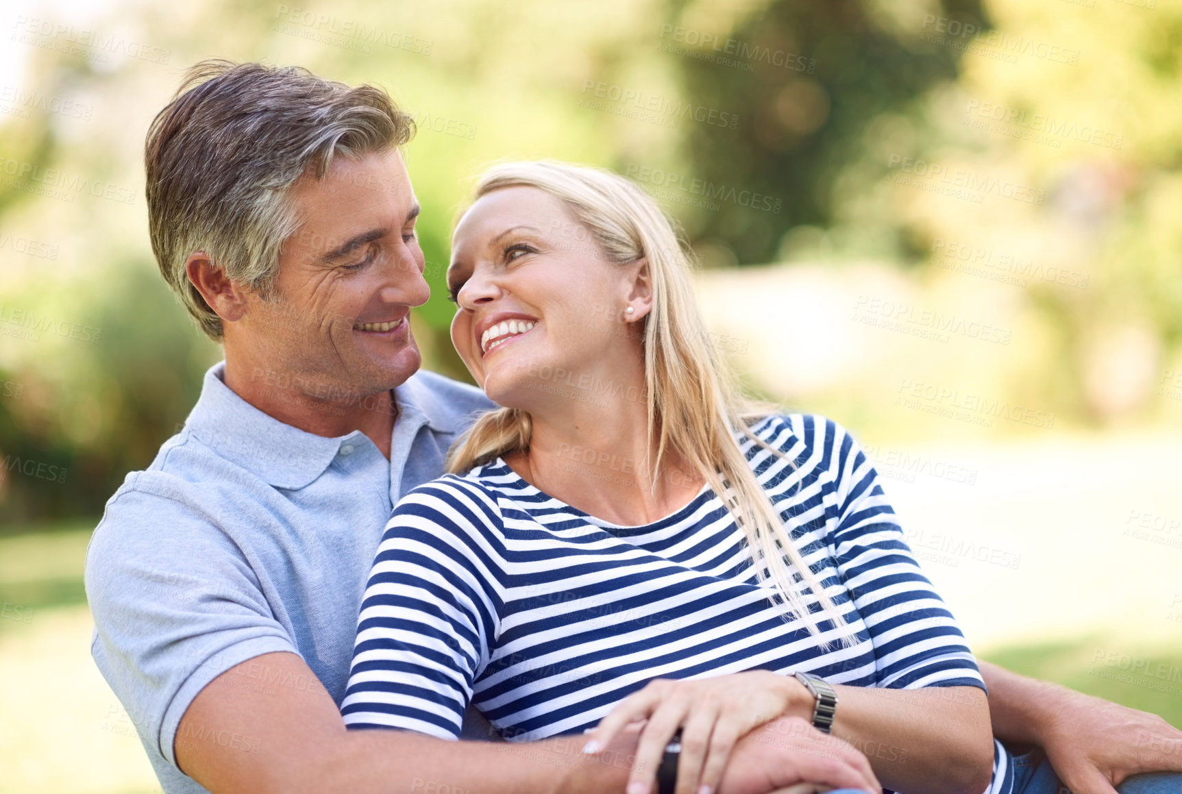 Buy stock photo Hug, smile and mature couple outdoor on date at park for love, care or romance. Happy man, woman and embrace at garden for healthy relationship, bonding together and partnership commitment on holiday