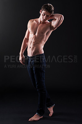 Buy stock photo Jeans, athlete and portrait of man in studio for fitness, muscle and pride in healthy body. Bodybuilder, male person and serious with confidence on black background for sports, wellness and shirtless