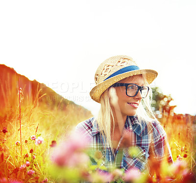 Buy stock photo Lens flare, thinking and woman with flowers in field for freedom, wellness and contemplation outdoors. Countryside, summer and hipster female person in meadow for relaxing, calm and peace in morning