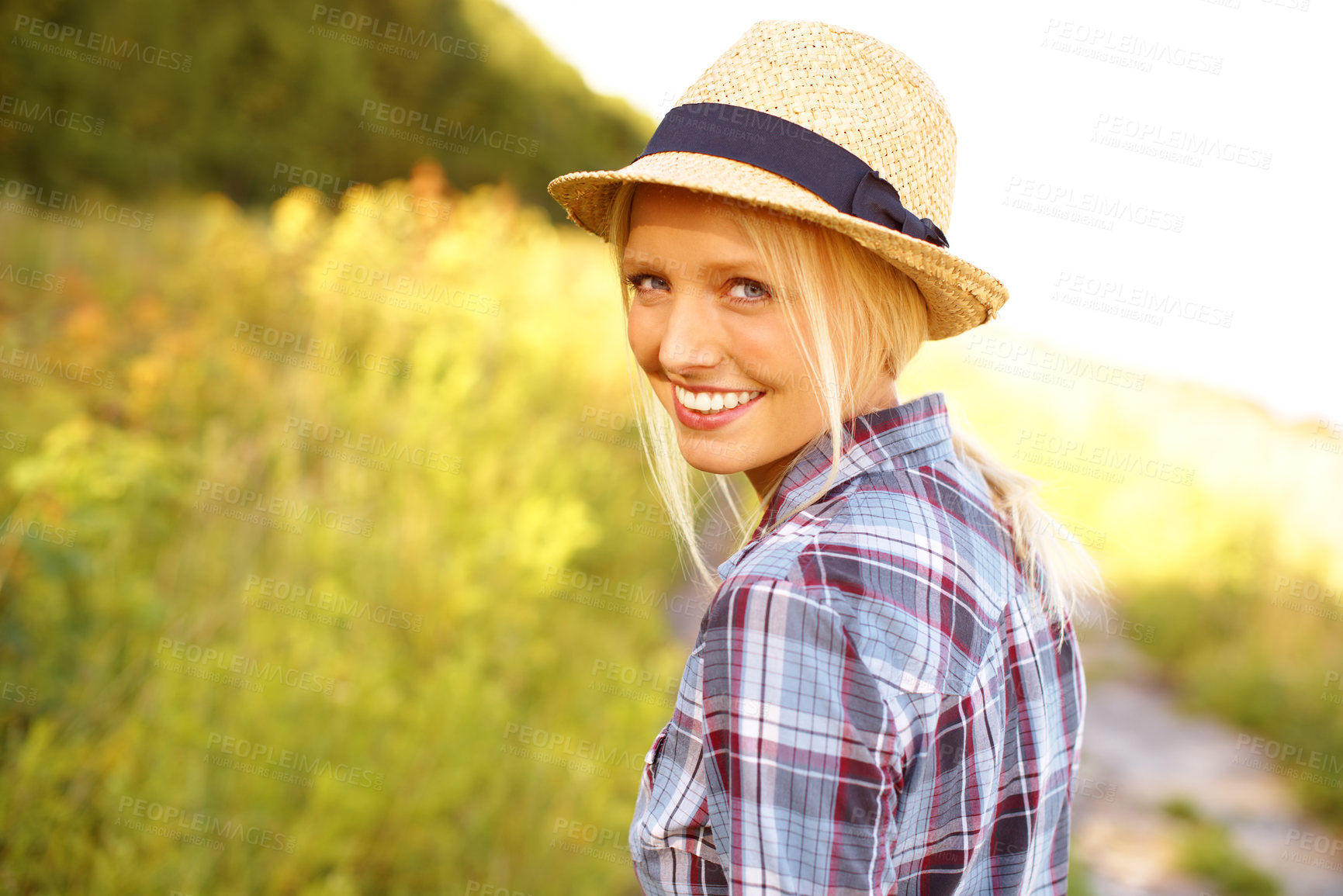 Buy stock photo Smile, walking and portrait of woman in nature with a straw hat in an outdoor garden for fresh air. Happy, fashion and female person from Australia in the forest, woods or field with casual style.
